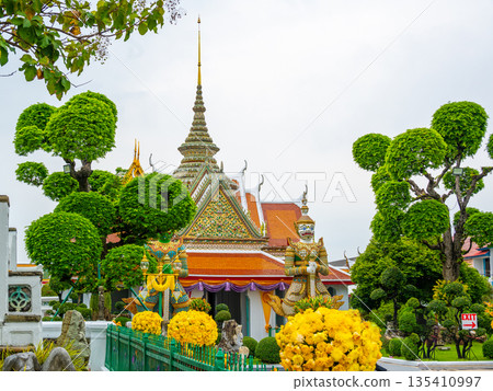 Wat Arun Ratchawararam Ratchawaramahawihan temple at Bangkok, Thailand. Buddhist temple, famous tourist destination. Wat Arun Ratchawararam Ratchawaramahawihan temple at Bangkok, Thailand. Buddhist temple, famous tourist destination. 135410997