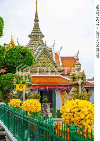 Wat Arun Ratchawararam Ratchawaramahawihan temple at Bangkok, Thailand. Buddhist temple, famous tourist destination. 135410998