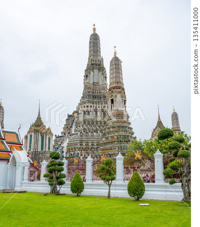 Wat Arun Ratchawararam Ratchawaramahawihan temple at Bangkok, Thailand. Buddhist temple, famous tourist destination. Wat Arun Ratchawararam Ratchawaramahawihan temple at Bangkok, Thailand. Buddhist temple, famous tourist destination. 135411000