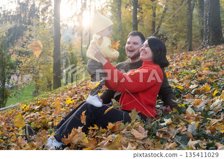 Family Enjoying Autumn in the Forest 135411029