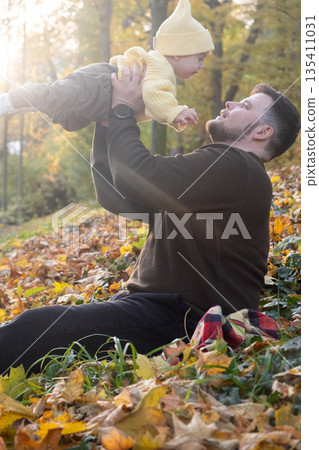 Father and Baby Enjoying Autumn in the Park 135411031