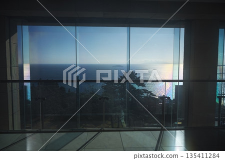 View of the sparkling sea outside the window from the MOA Museum of Art lobby View of the sparkling sea outside the window from the MOA Museum of Art lobby 135411284