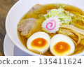 Close-up of an egg in soy sauce ramen 135411624