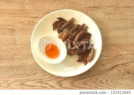 fried crispy salty fermenting beef fat meat with pepper on plate dipping spicy and sour chili sauce fried crispy salty fermenting beef fat meat with pepper on plate dipping spicy and sour chili sauce 135411645