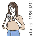 Illustration of a young woman using a smartphone 135411854