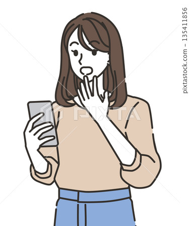 Surprised young woman looking at smartphone Surprised young woman looking at smartphone 135411856