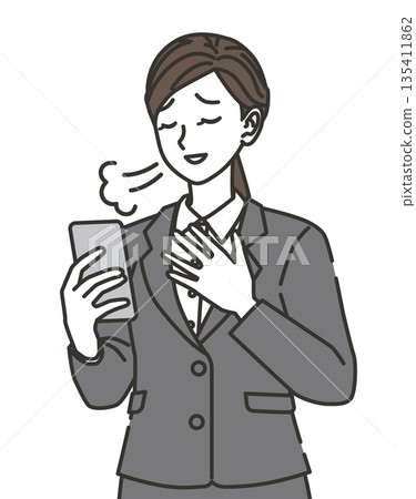 A woman in a suit checking her smartphone and feeling relieved A woman in a suit checking her smartphone and feeling relieved 135411862