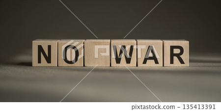 Text NO WAR on wooden cubes. No aggression. Square wood blocks. Text NO WAR on wooden cubes. No aggression. Square wood blocks. 135413391