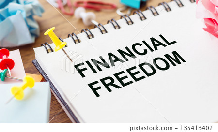 Text financial freedom on note paper on office table 135413402