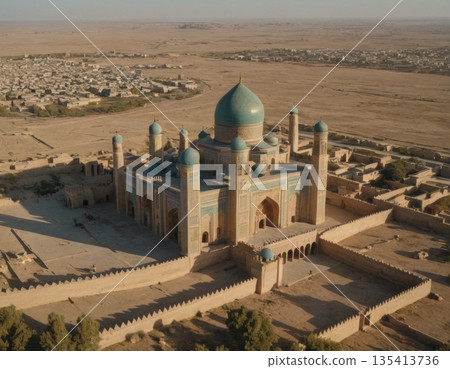 Aerial view of a historic mosque surrounded by desert landscapes under a clear sky at sunset. Generative AI 135413736