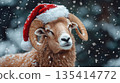 A festive ram celebrates Christmas in a Santa hat, surrounded by a beautiful snowy winter landscape. 135414772