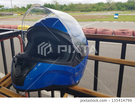 a Blue racing helmet close-up outdoor 135414799