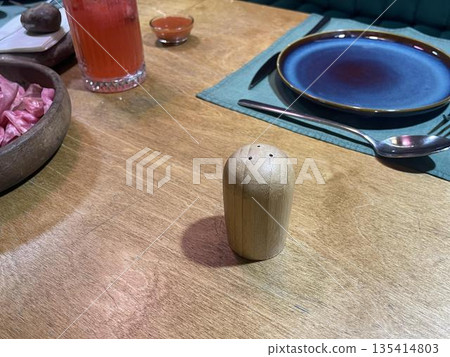 a salt on the wooden table in cafe a salt on the wooden table in cafe 135414803
