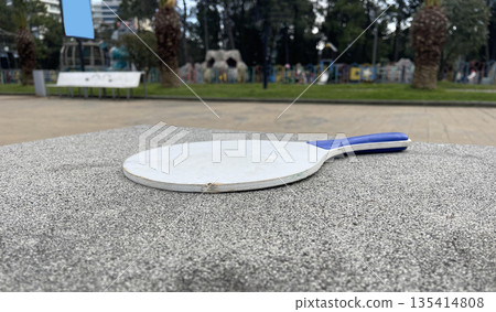a racket on the bench a racket on the bench 135414808