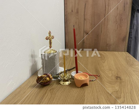 home orthodox altar with candles, crucifix and other religion things home orthodox altar with candles, crucifix and other religion things 135414828