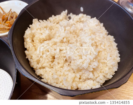 Brown rice in a rice container Brown rice in a rice container 135414855