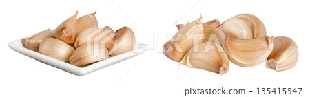 garlic cloves in ceramic bowl isolated on white background close up garlic cloves in ceramic bowl isolated on white background close up 135415547