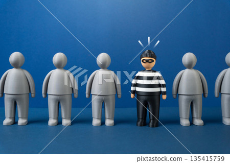 A criminal among the gray crowd. Find the insider and the fraudster. Monitoring illegal activity. Insider threat awareness, security vigilance and risk detection. Corporate safety 135415759