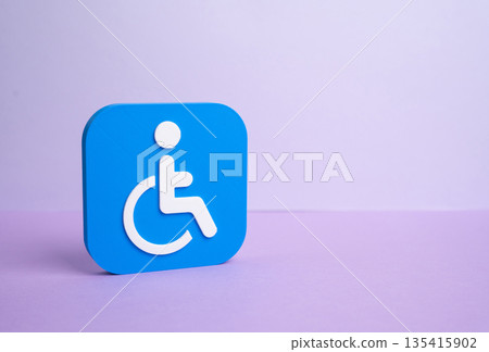 Symbol of a person with a disability on a lilac background. Legal status and benefits. Social rights concept, access to support, inclusion policies and formal recognition procedures Symbol of a person with a disability on a lilac background. Legal status and benefits. Social rights concept, access to support, inclusion policies and formal recognition procedures 135415902