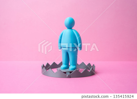 A male figurine as bait in a trap. A romantic relationship trap. Online dating fraud. Scam awareness concept, emotional manipulation, financial deception and digital trust risks 135415924
