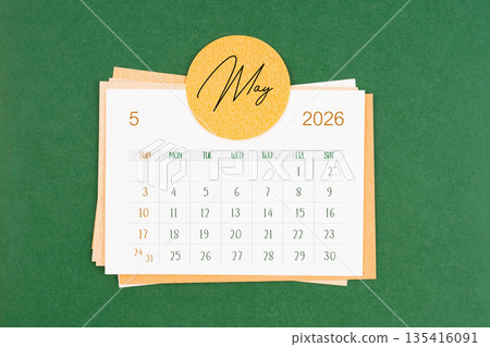 May 2026 calendar page on green background. 135416091