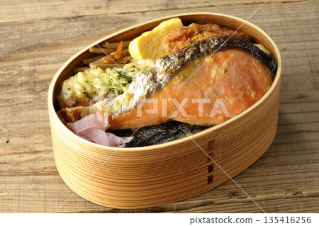 Chikuwa tempura, fried chicken, grilled salmon, and nori bento 135416256