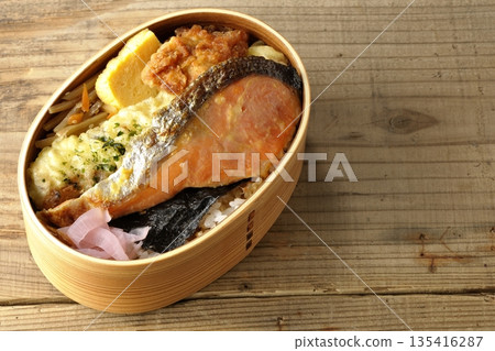 Chikuwa tempura, fried chicken, grilled salmon, and nori bento Chikuwa tempura, fried chicken, grilled salmon, and nori bento 135416287