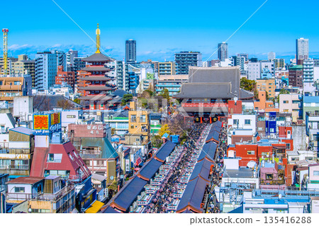 Tokyo cityscape in Japan on New Year's Day. An astounding crowd... Sensoji Temple and Nakamise Street are filled with worshippers. A new era... = January 1, 2026 135416288