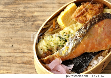 Chikuwa tempura, fried chicken, grilled salmon, and nori bento Chikuwa tempura, fried chicken, grilled salmon, and nori bento 135416290