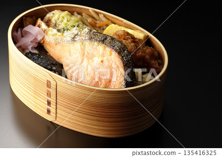 Chikuwa tempura, fried chicken, grilled salmon, and nori bento 135416325