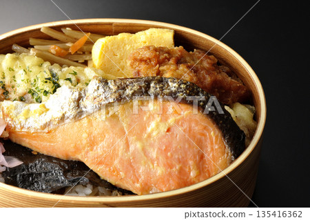 Chikuwa tempura, fried chicken, grilled salmon, and nori bento 135416362