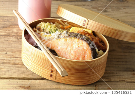 Chikuwa tempura, fried chicken, grilled salmon, nori bento and water bottle Chikuwa tempura, fried chicken, grilled salmon, nori bento and water bottle 135416521