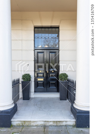 Classic black front door of a luxury London townhouse 135416709