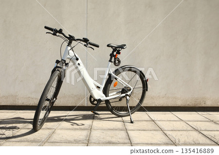 Bicycle isolated on a wall background, with copy space for text 135416889
