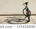 Bicycle isolated on a wall background, with copy space for text 135416890