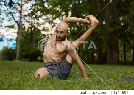 Athletic performer demonstrates muscle control during evening session 135416921