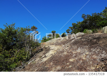 Blue sky and rocky area Blue sky and rocky area 135417319