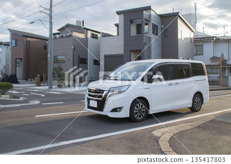 One-box car/minivan driving on the road One-box car/minivan driving on the road 135417803