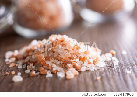 Pink Himalayan salt on wooden table. Pink Himalayan salt on wooden table. 135417966
