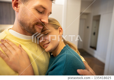 Peaceful couple man and woman partners hugging and showing strong bond an love in relationships. 135418025