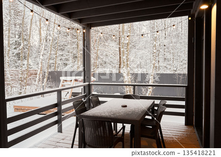 Cozy sunset gathering, Evening patio with warm illumination Cozy sunset gathering, Evening patio with warm illumination 135418221