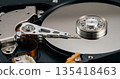 Close up view of the inside of a hard disk drive. HDD data storage mechanism. 135418463