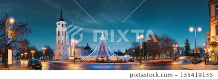 Vilnius, Lithuania. Christmas Tree On Background Bell Tower Belfry Of Vilnius Cathedral At Cathedral Square In Evening New Year Christmas Xmas Illuminations. Unesco World Heritage Site 135419136