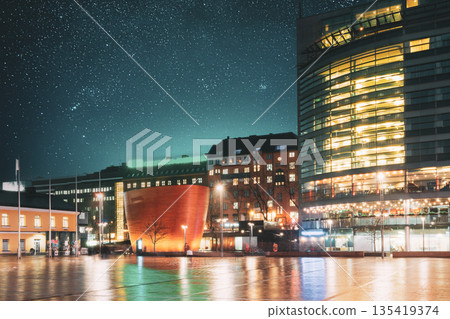 Helsinki, Finland. Kamppi Chapel Or Chapel Of Silence In Evening Illumination On Narinkka Square. Chapel Operated By Helsinki Parish Union And Social Services Department Of Helsinki. Night stars Helsinki, Finland. Kamppi Chapel Or Chapel Of Silence In Evening Illumination On Narinkka Square. Chapel Operated By Helsinki Parish Union And Social Services Department Of Helsinki. Night stars 135419374
