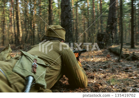 Russian Soviet Infantry Red Army Soldiers Of World War II with weapons Running On Forest Battlefield in attack 135419702