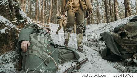 Heroes Of War. American Infantry Soldier Pass By Corpses Of Germ 135419705