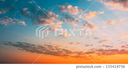 Sunset Sunrise Sky Background. Natural Bright Dramatic Sky In Sunset Dawn Sunrise. Yellow And Pink Colors Sunset Sunrise Sky Background. Natural Bright Dramatic Sky In Sunset Dawn Sunrise. Yellow And Pink Colors 135419736