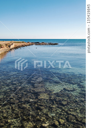 Clear Mediterranean water over rocky shoreline Clear Mediterranean water over rocky shoreline 135419845