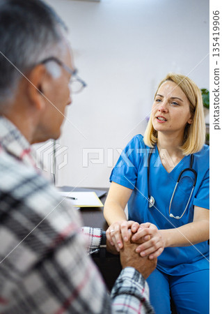 Compassionate healthcare conversation in a clinic Compassionate healthcare conversation in a clinic 135419906