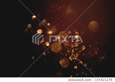 Golden abstract bokeh on black background. Golden abstract bokeh on black background. 135421278